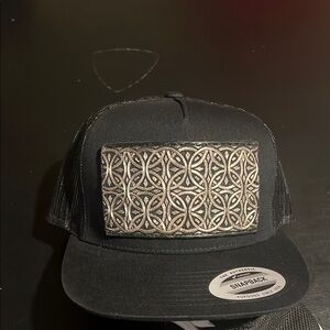 Black Snapback Cap with Intricate Design